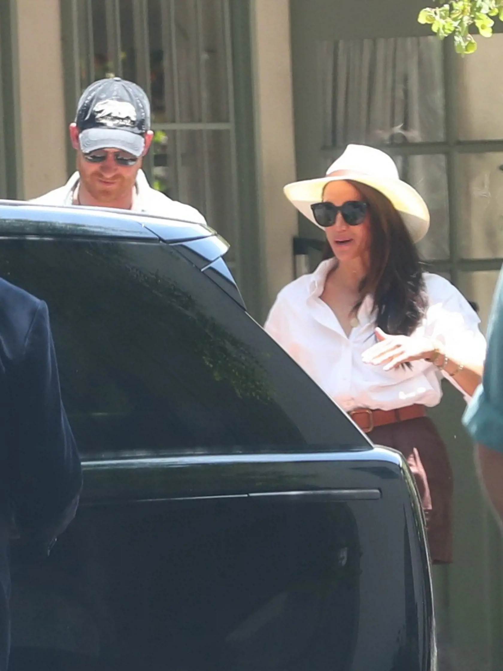 Posledné spoločné fotografie páru: Meghan je vyrehotaná od ucha k uchu, no Harry sa mračí.