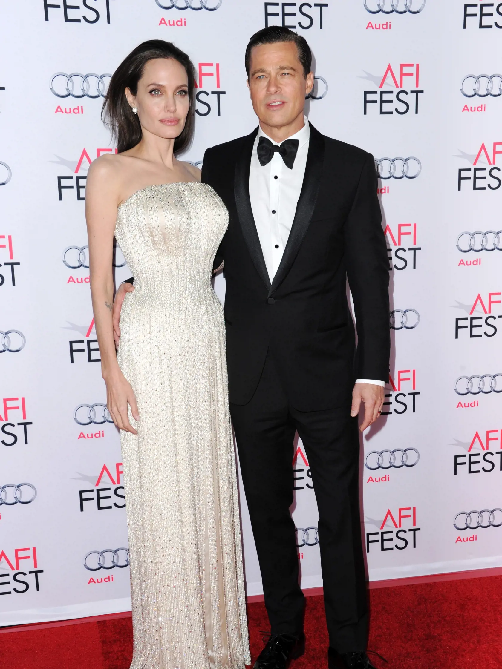 Angelina Jolie, left, and Brad Pitt arrive at the 2015 AFI Fest opening night premiere of "By The Sea" on Thursday, Nov. 5, 2015, in Los Angeles. (Photo by Richard Shotwell/Invision/AP)