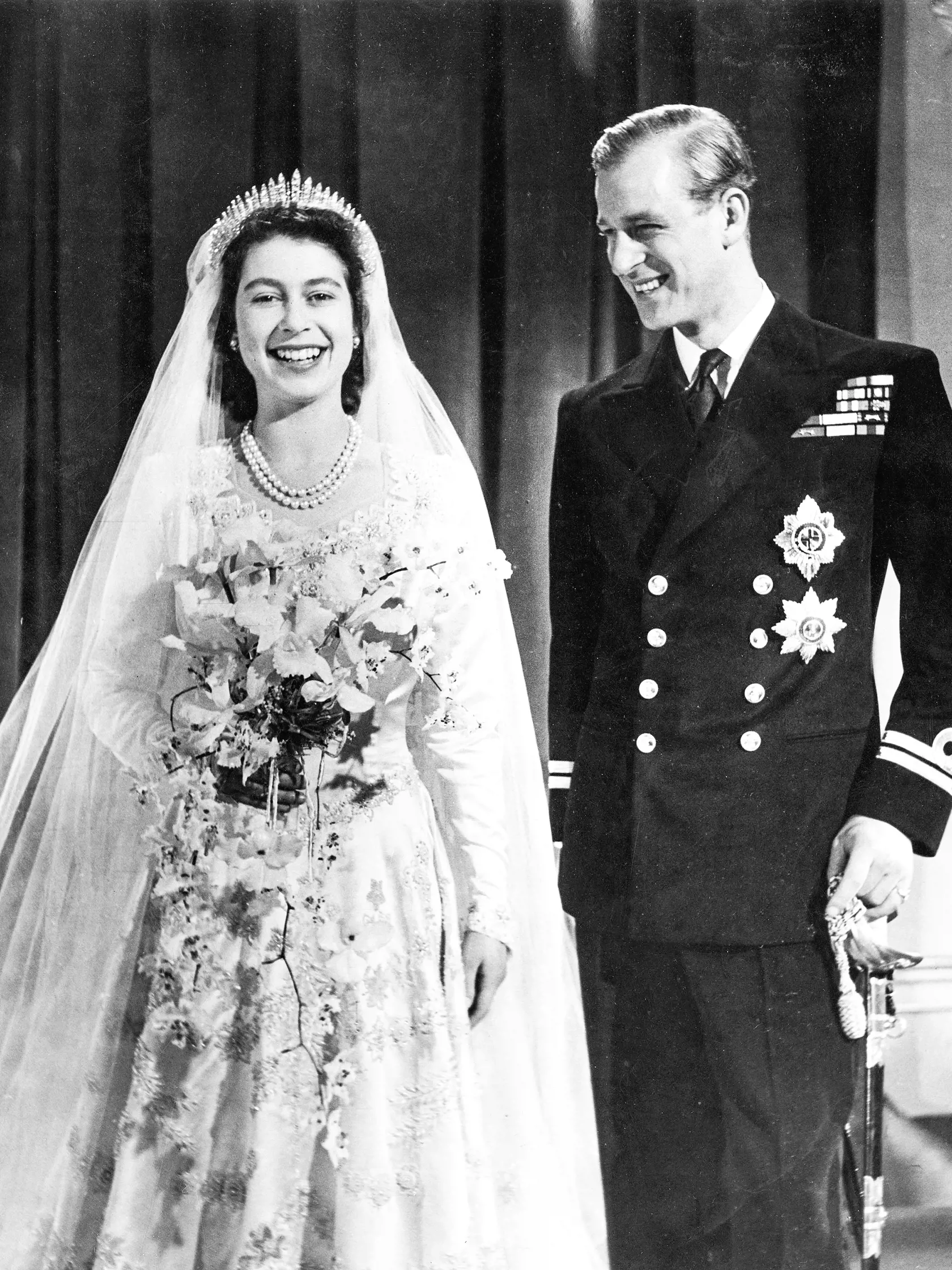 Princess Elizabeth (Queen Elizabeth II) and Prince Philip, Duke of Edinburgh (formerly Lieutenant Philip Mountbatten) pose together for an official photograph following their marriage at Westminster Abbey on 20 November 1947.,Image: 164885509, License: Rights-managed, Restrictions: , Model Release: no