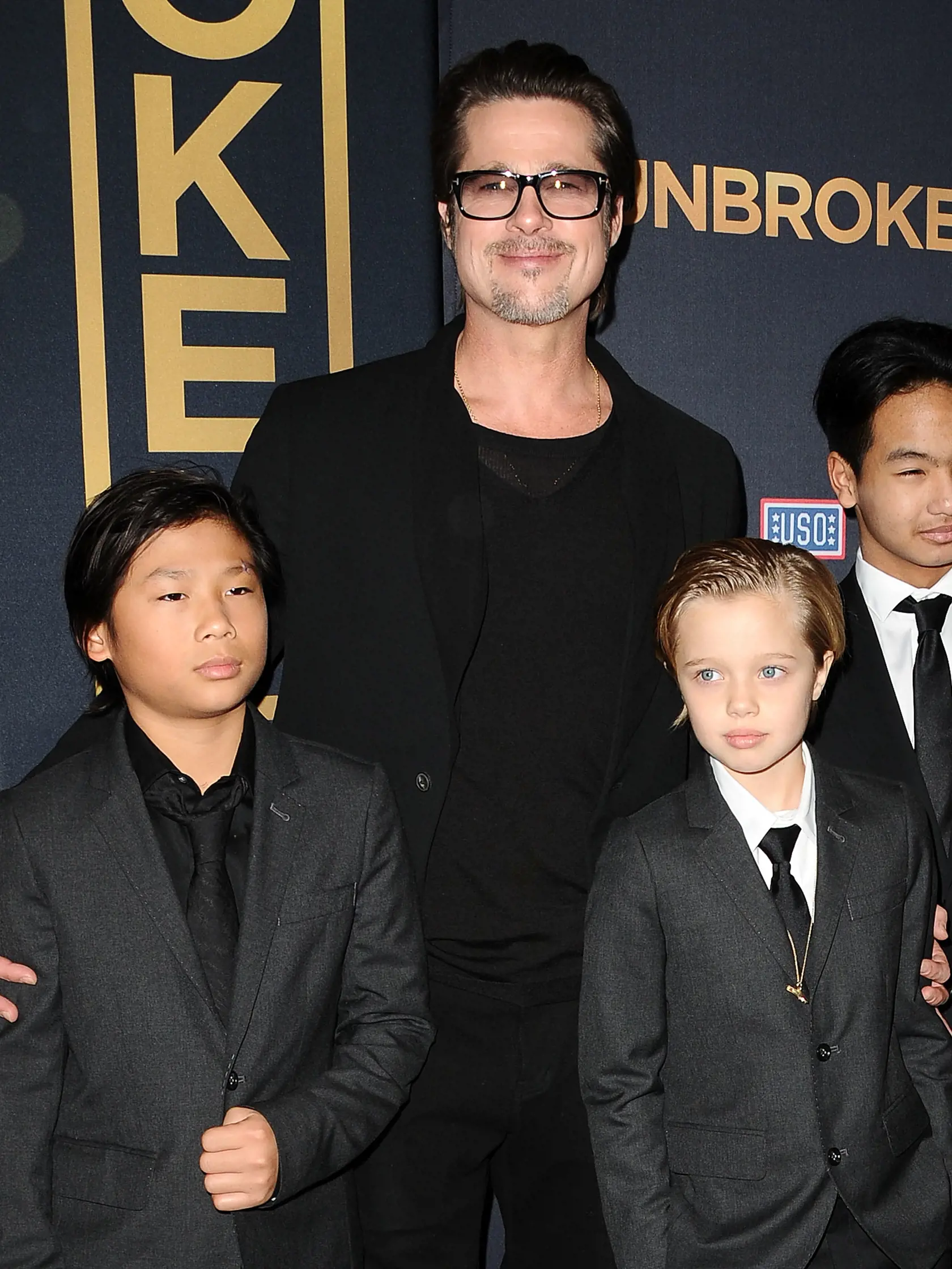 HOLLYWOOD, CA - DECEMBER 15:  Actor Brad Pitt (C), (L-R) Pax Thien Jolie-Pitt, Shiloh Nouvel Jolie-Pitt and Maddox Jolie-Pitt attend the premiere of "Unbroken" at TCL Chinese Theatre IMAX on December 15, 2014 in Hollywood, California.  (Photo by Jason LaVeris/FilmMagic)