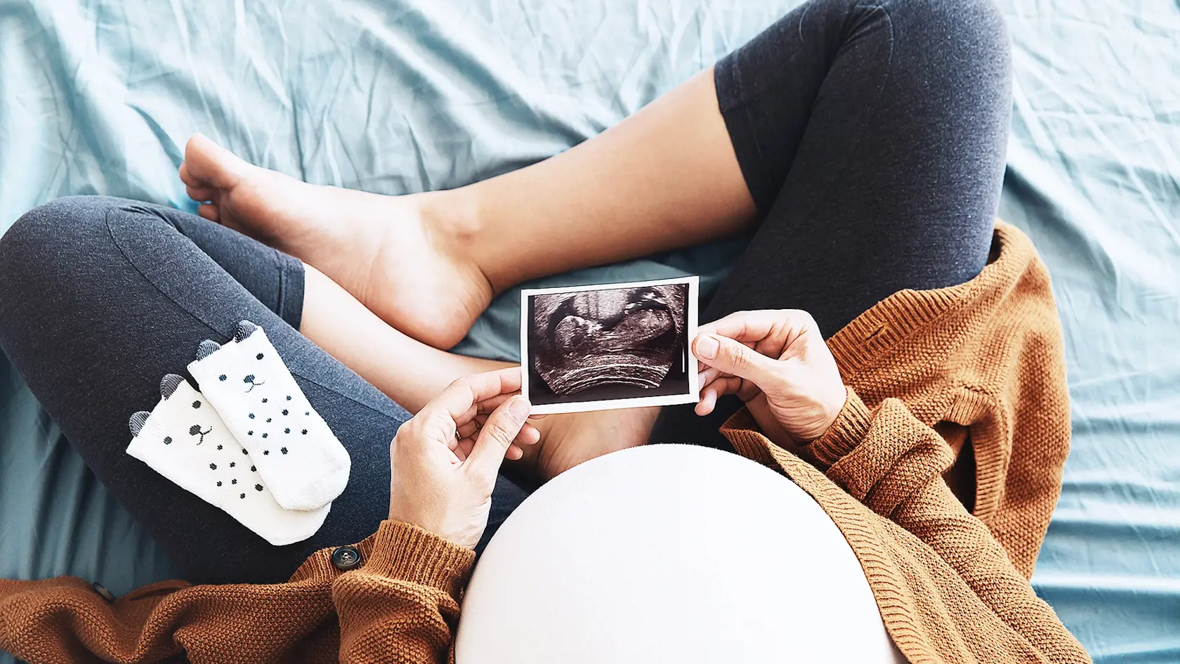 Pregnant,Woman,Holding,Ultrasound,Image.,Concept,Of,Pregnancy,,Health,Care,