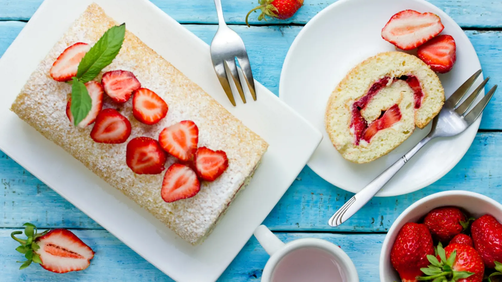 Strawberry,Cake,Roll,On,Blue,Wooden,Background,Top,View