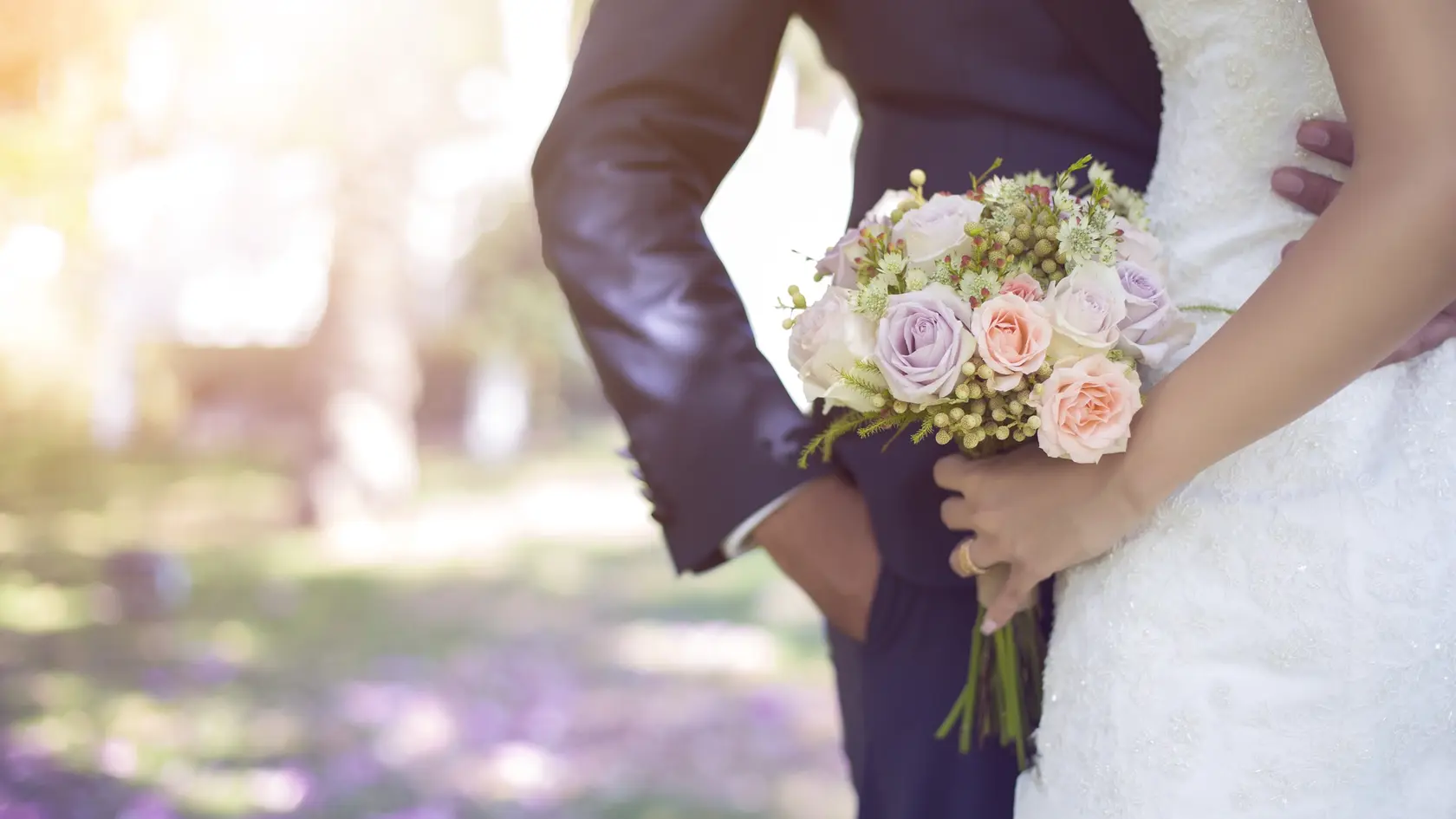 Bride holding bouquet.