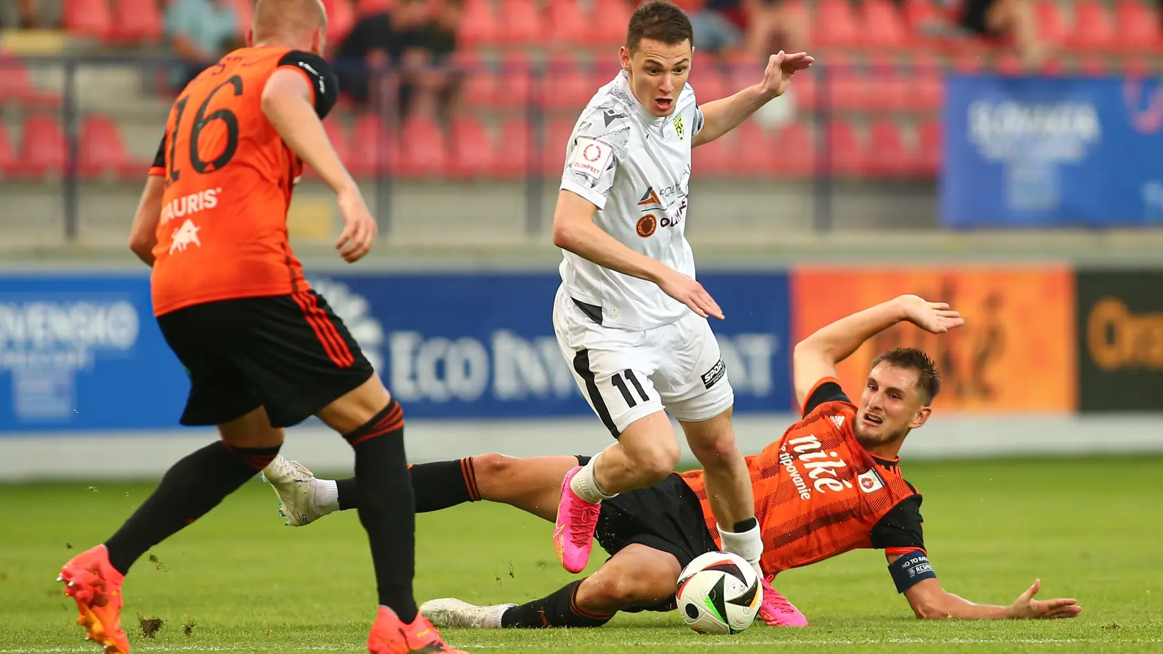 Na snímke zľava v súboji o loptu Daniel Köstl (Ružomberok), Islam Česnokov (Tobol) a Martin Chrien (Ružomberok).