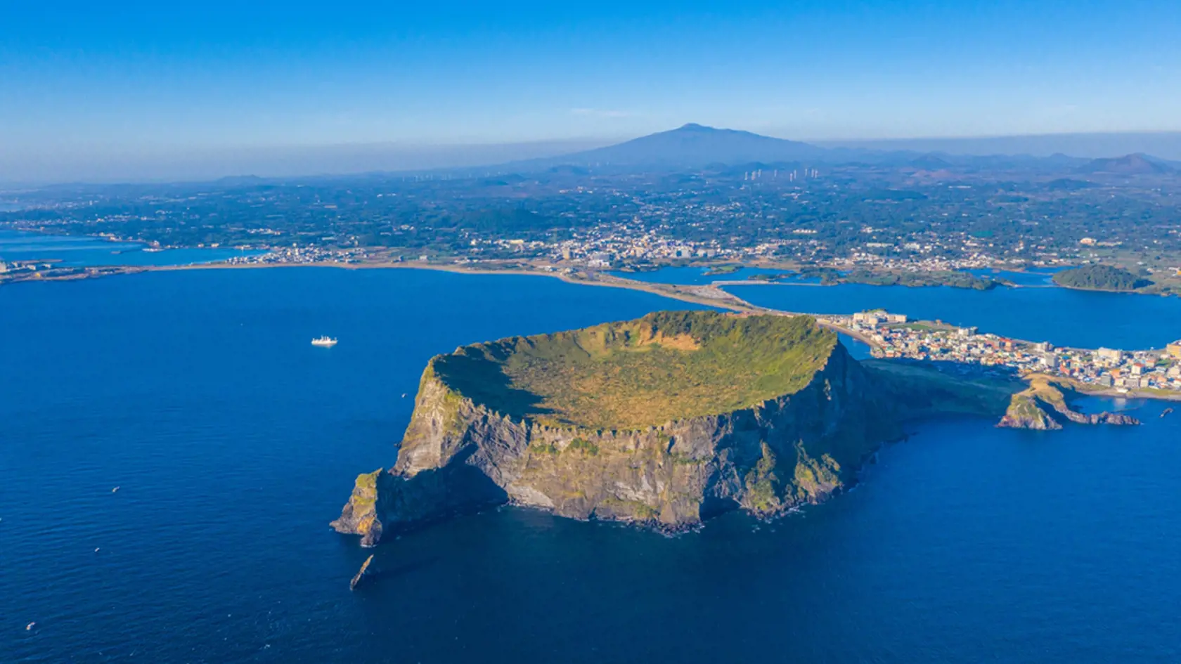 Sunrise view of Seongsan Ilchulbong known as sunrise peak at Jeju Island, Republic of Korea