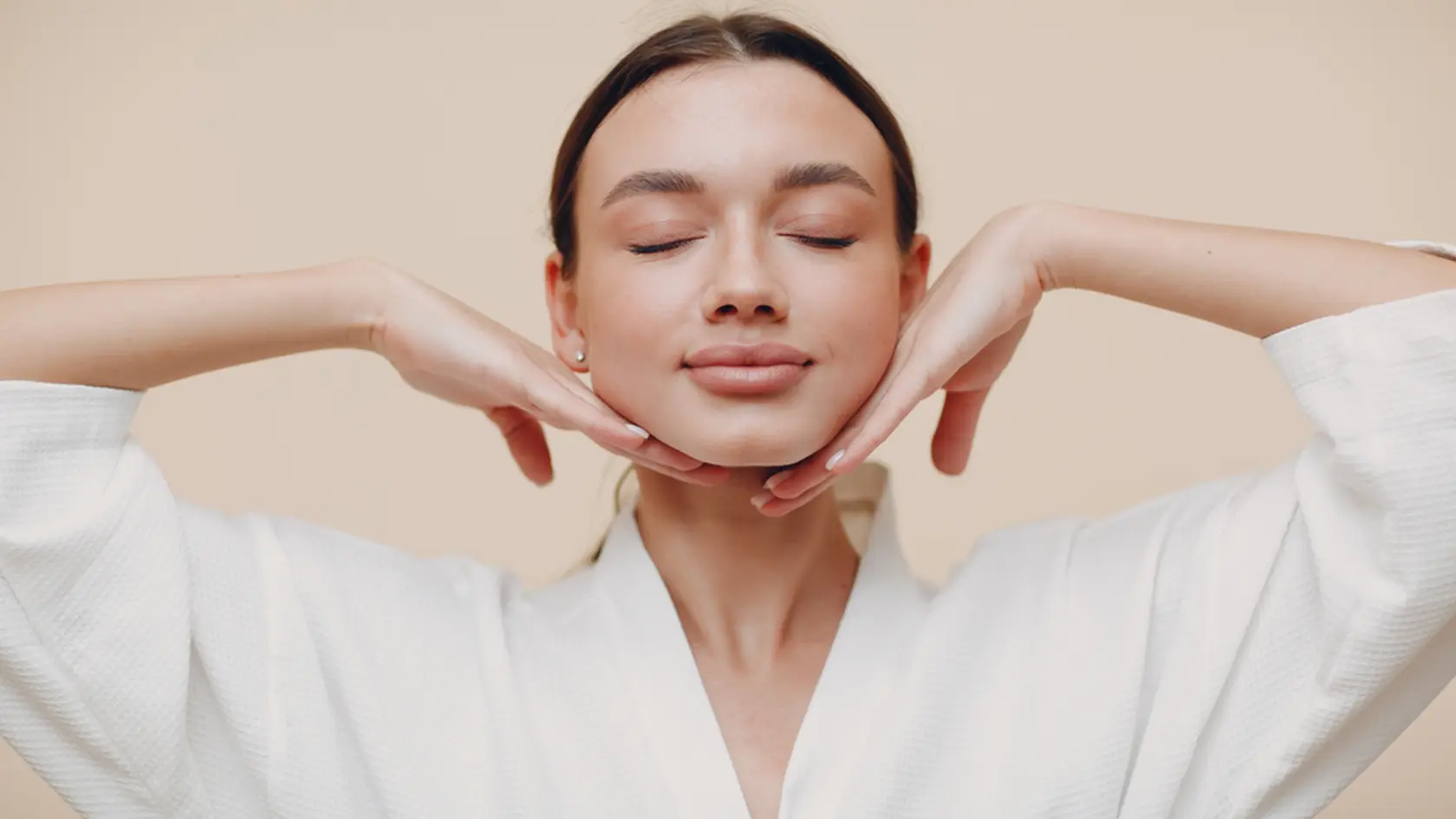 Young woman doing face building yoga facial gymnastics self massage and rejuvenating exercises