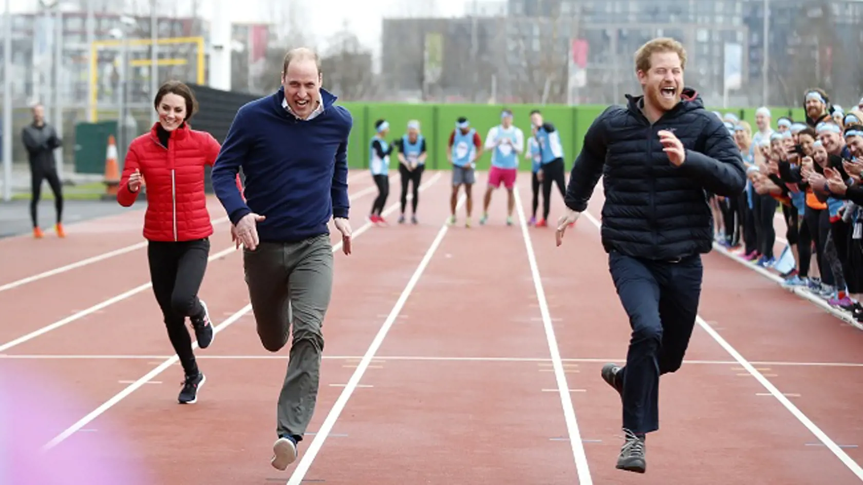 Britain's Prince William, second left,  Kate, the Duchess of Cambridge, left, and Prince Harry take part in a relay race, during a training event to promote the charity Heads Together, at the Queen Elizabeth II Park in London, Sunday, Feb. 5, 2017. (AP Photo/Alastair Grant, Pool)