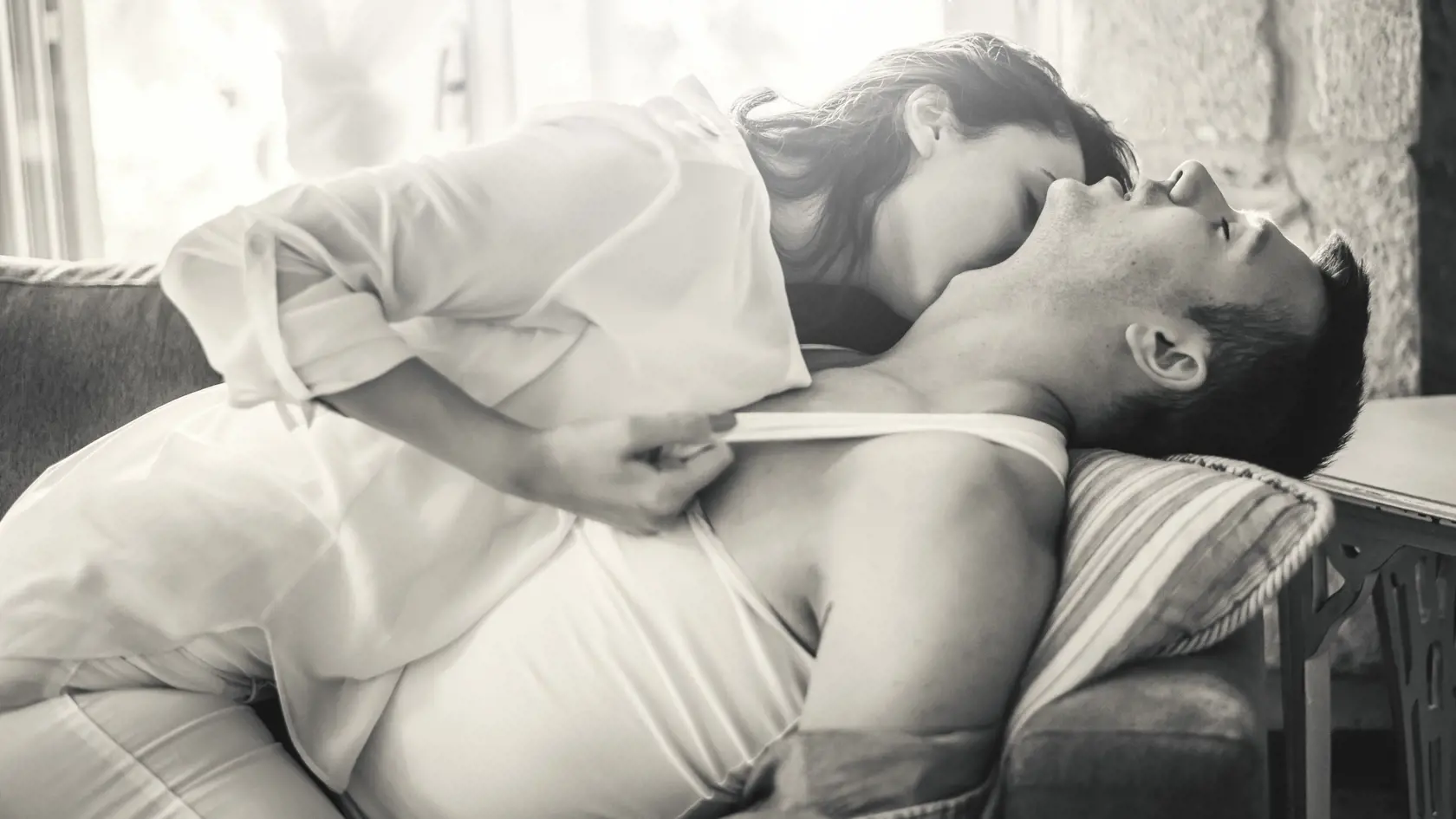 Love Couple have intimate moments at the sofa bed.