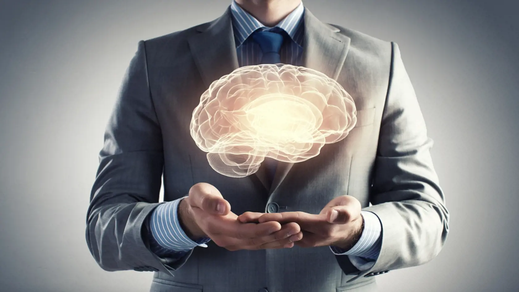 Close,Up,Of,Businessman,Holding,Digital,Image,Of,Brain,In