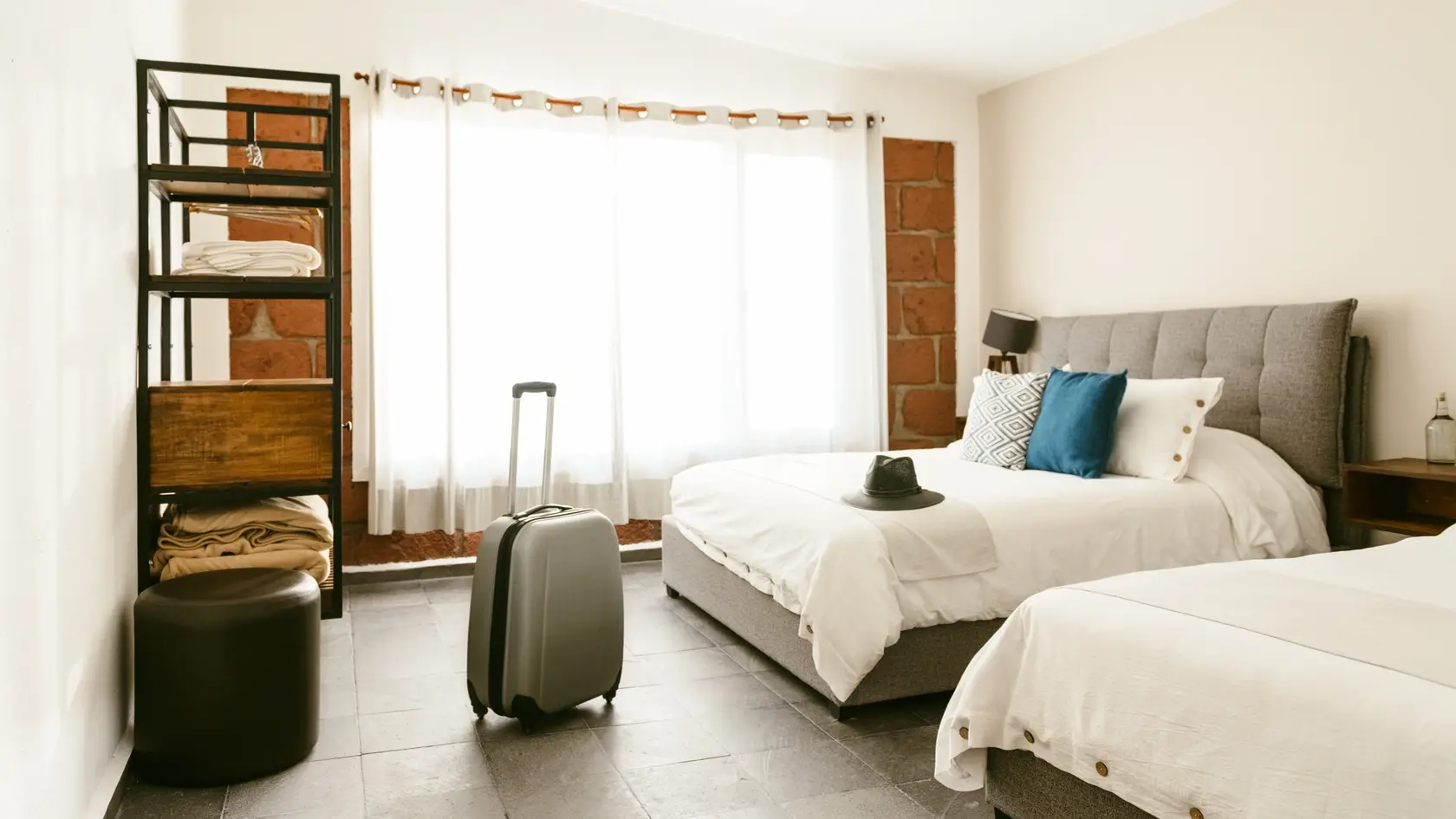 Backlit suitcase in hotel room