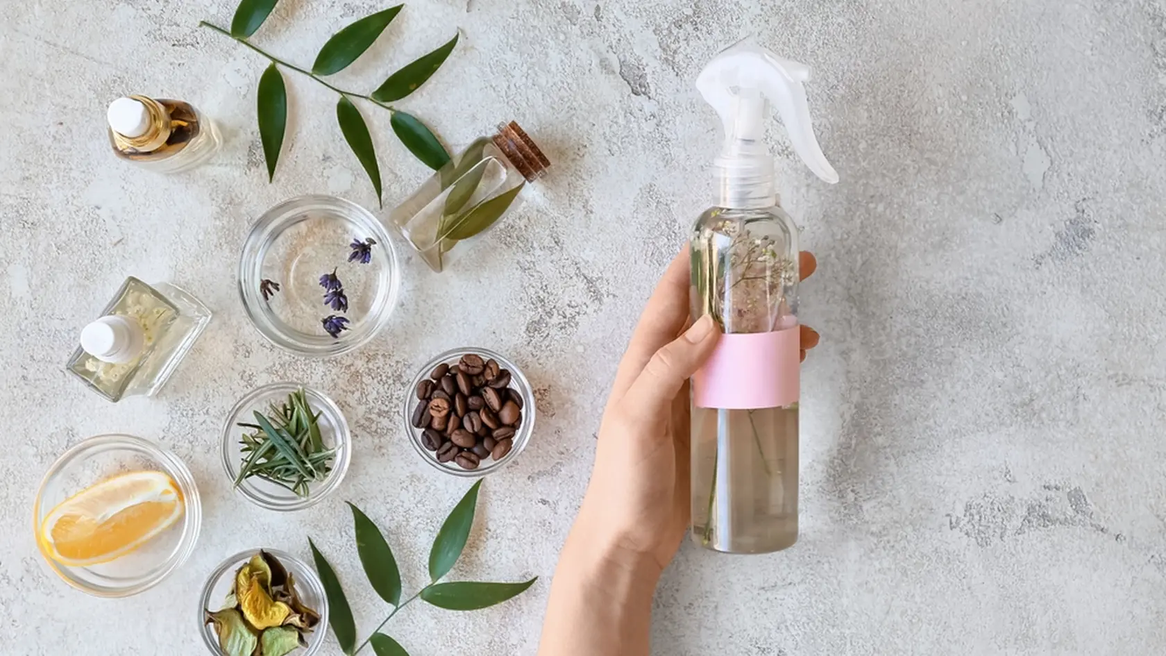 Woman with natural homemade air freshener at table