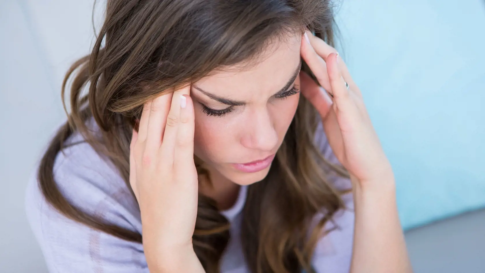 Sick woman suffering from head ache