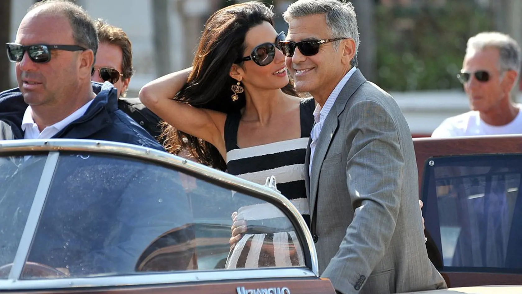 George Clooney and his fiancee Amal Alamuddin arrive in Venice, Italy, Friday, Sept. 26, 2014. Clooney, 53, and Alamuddin, 36, are expected to get married this weekend in Venice, one of the world's most romantic settings. (AP Photo/Luigi Costantini)