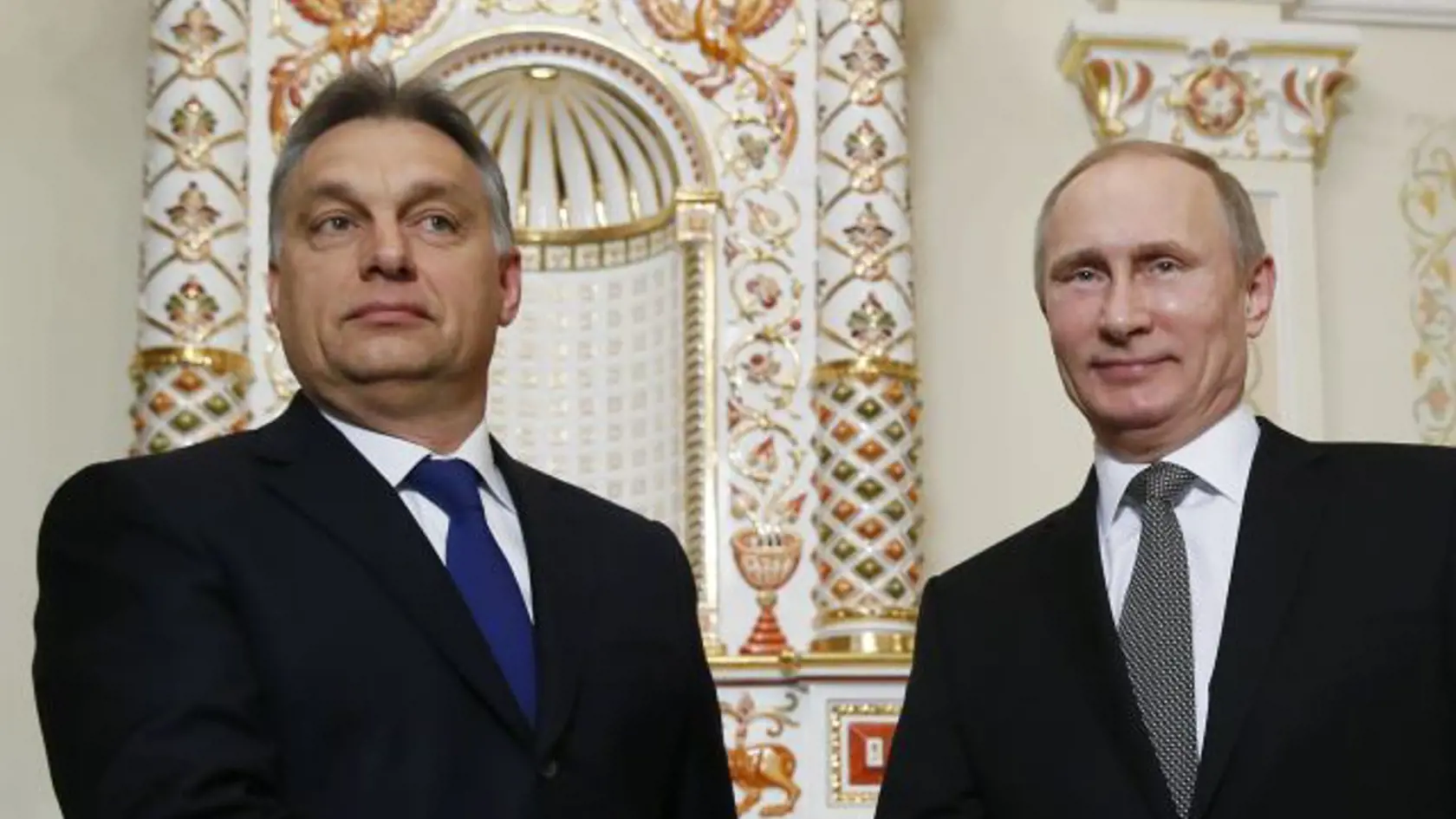 FILE - This is a Tuesday, Jan. 14, 2014  file photo of Russian President Vladimir Putin, right, and Hungarian Prime Minister Viktor Orban  as they meet in the Novo-Ogaryovo residence outside Moscow, Russia. Russian President Vladimir Putin travels to Budapest on Tuesday Feb. 17, 2015 to meet  Viktor Orban, the leader some Hungarians cast as his alter ego  “Little Putin.” (AP Photo/Yuri Kochetkov, Pool. File)