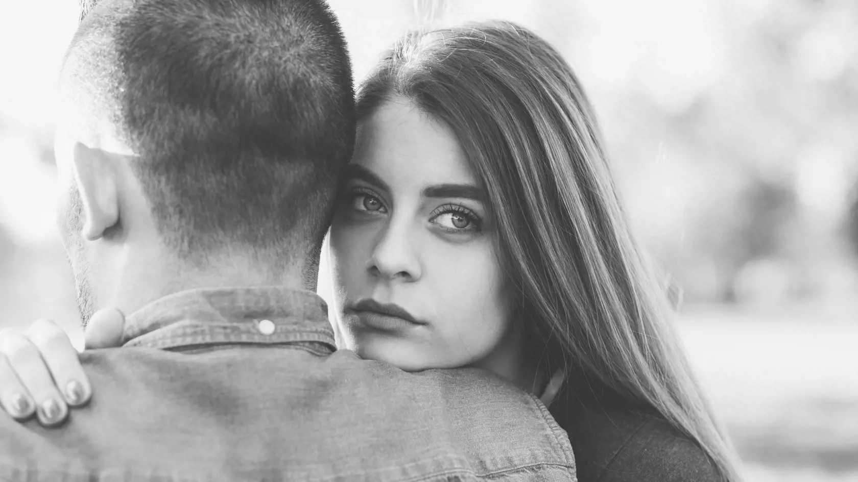 Young woman comforting unhappy friend