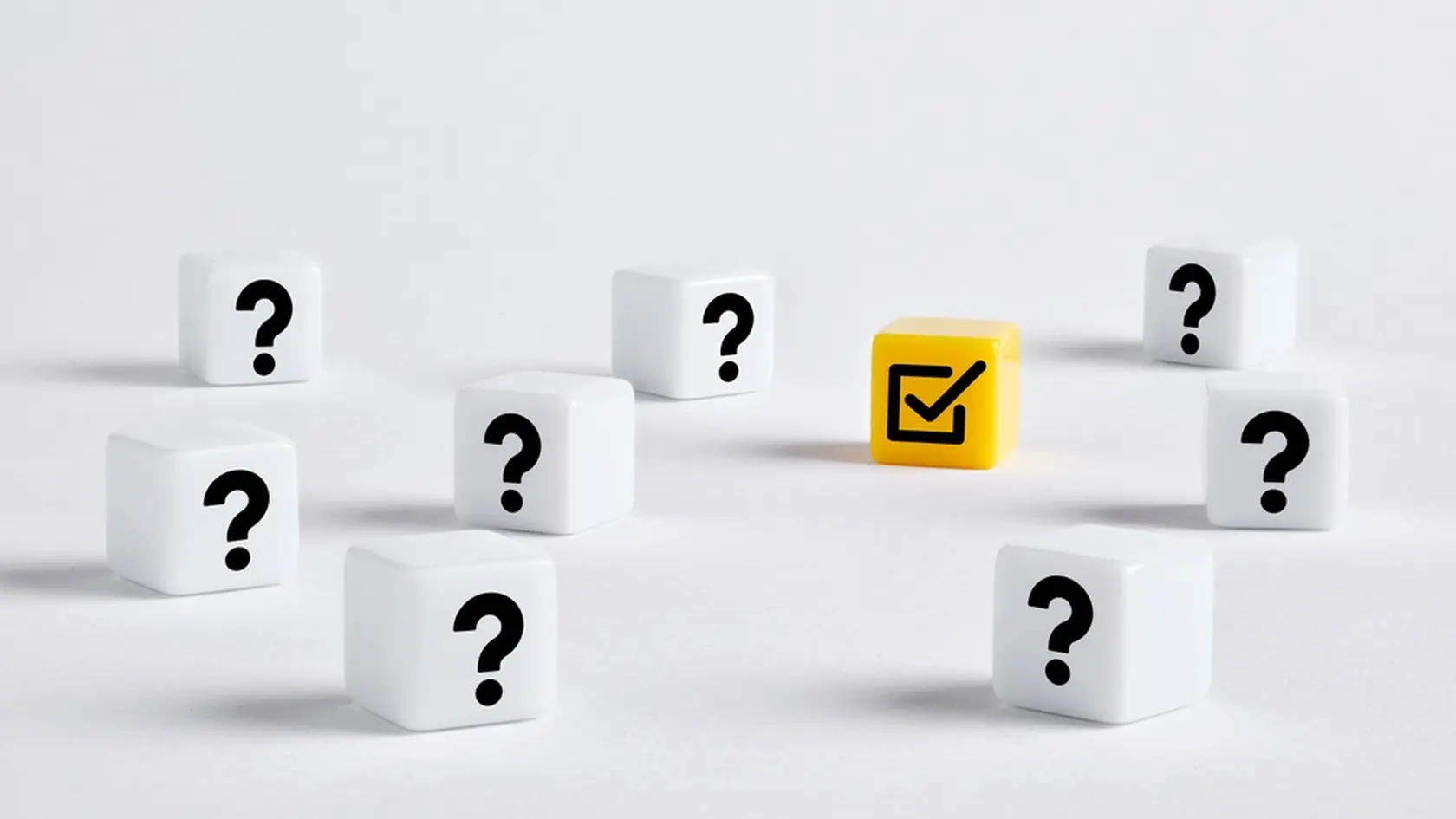 To make the right decision or to find the correct answer. Yellow cube with a check mark is standing out in the center of question mark cubes.