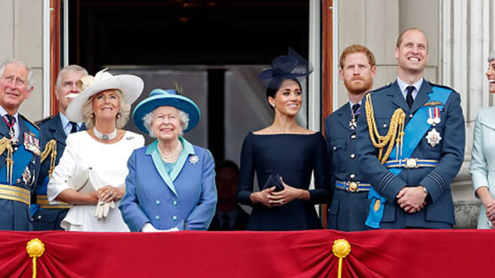 LONDON, UNITED KINGDOM - JULY 10: (EMBARGOED FOR PUBLICATION IN UK NEWSPAPERS UNTIL 24 HOURS AFTER CREATE DATE AND TIME) Prince Charles, Prince of Wales, Camilla, Duchess of Cornwall, Queen Elizabeth II, Meghan, Duchess of Sussex, Prince Harry, Duke of Sussex, Prince William, Duke of Cambridge and Catherine, Duchess of Cambridge watch a flypast to mark the centenary of the Royal Air Force from the balcony of Buckingham Palace on July 10, 2018 in London, England. The 100th birthday of the RAF, wh