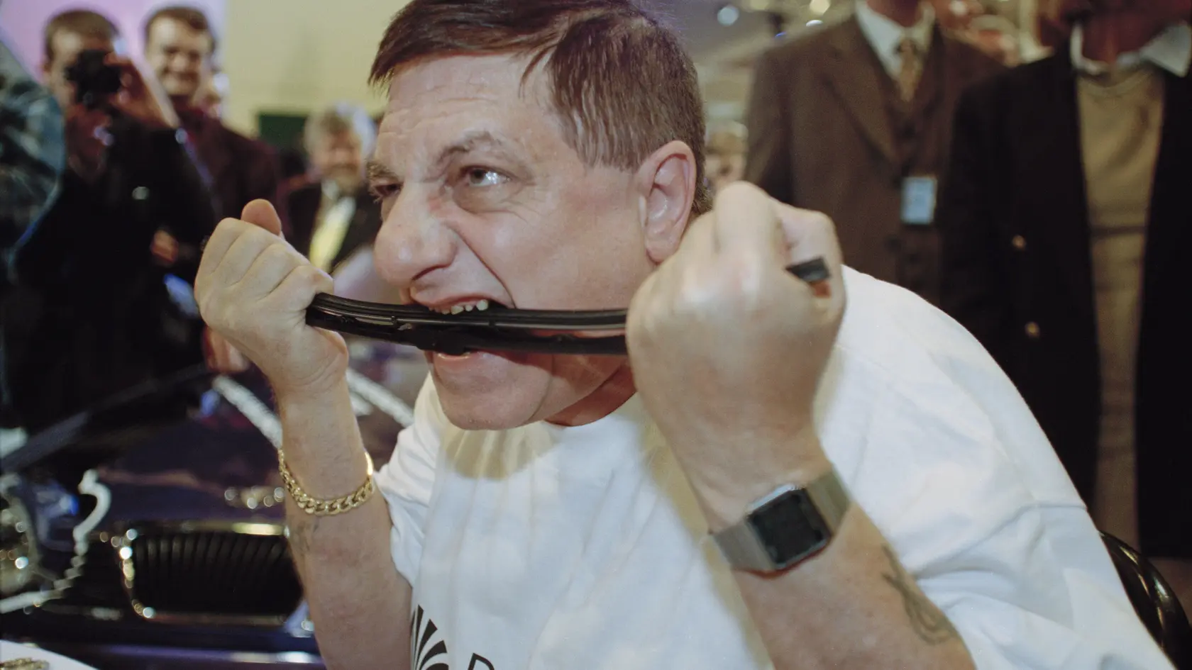 French entertainer Monsieur Mangetout (aka Michel Lotito, 1950 - 2007) bites into a windscreen wiper at the British International Motor Show in Earl's Court, London, UK, 14th October 1997. (Photo by Colin Davey/Getty Images)