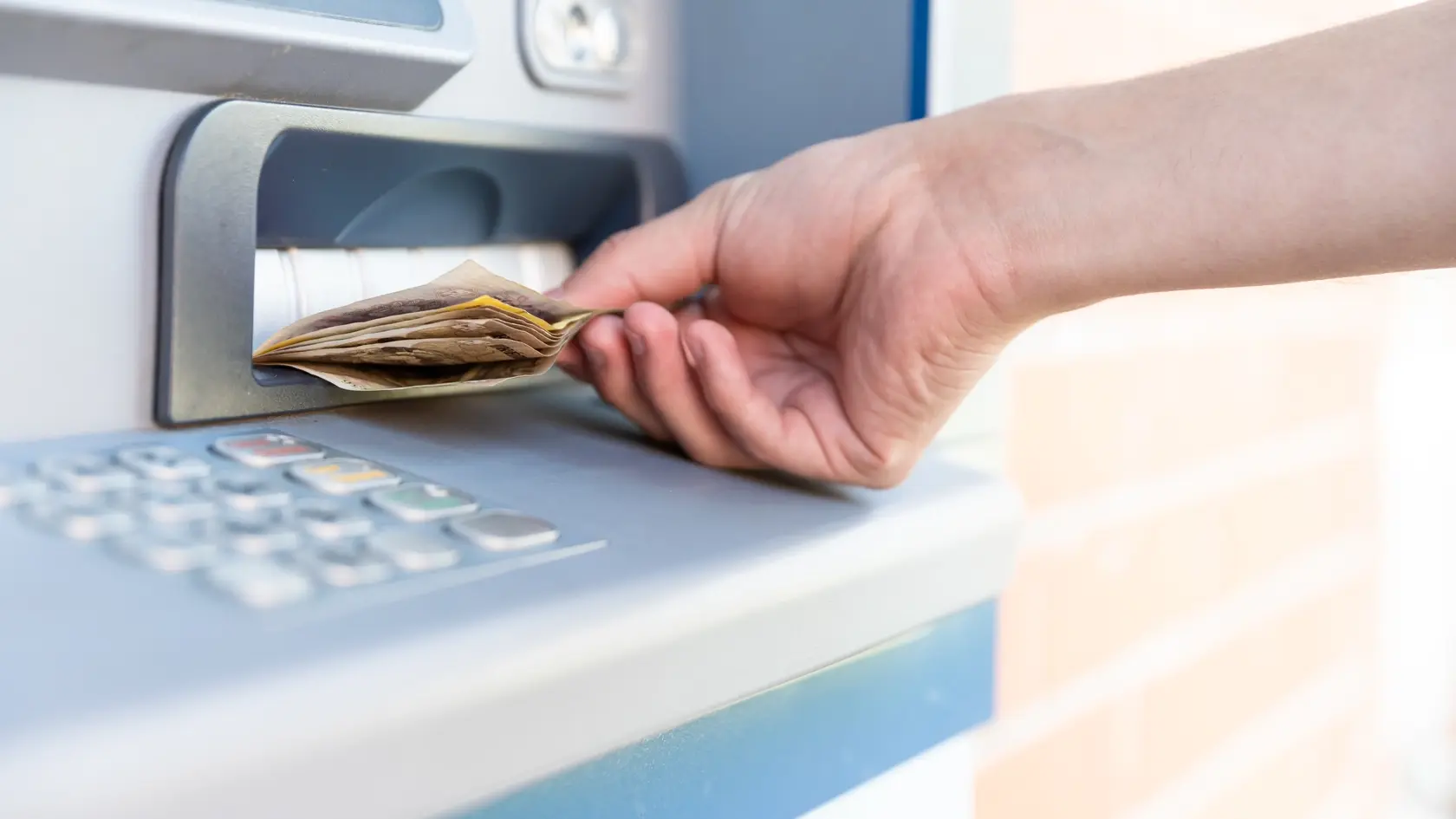 Withdraw cash from an ATM.