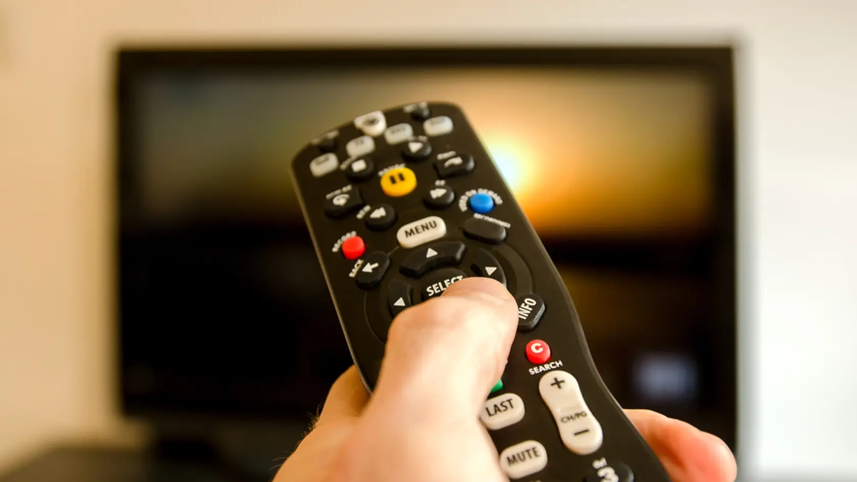 Watching,Tv,And,Using,Remote,Control