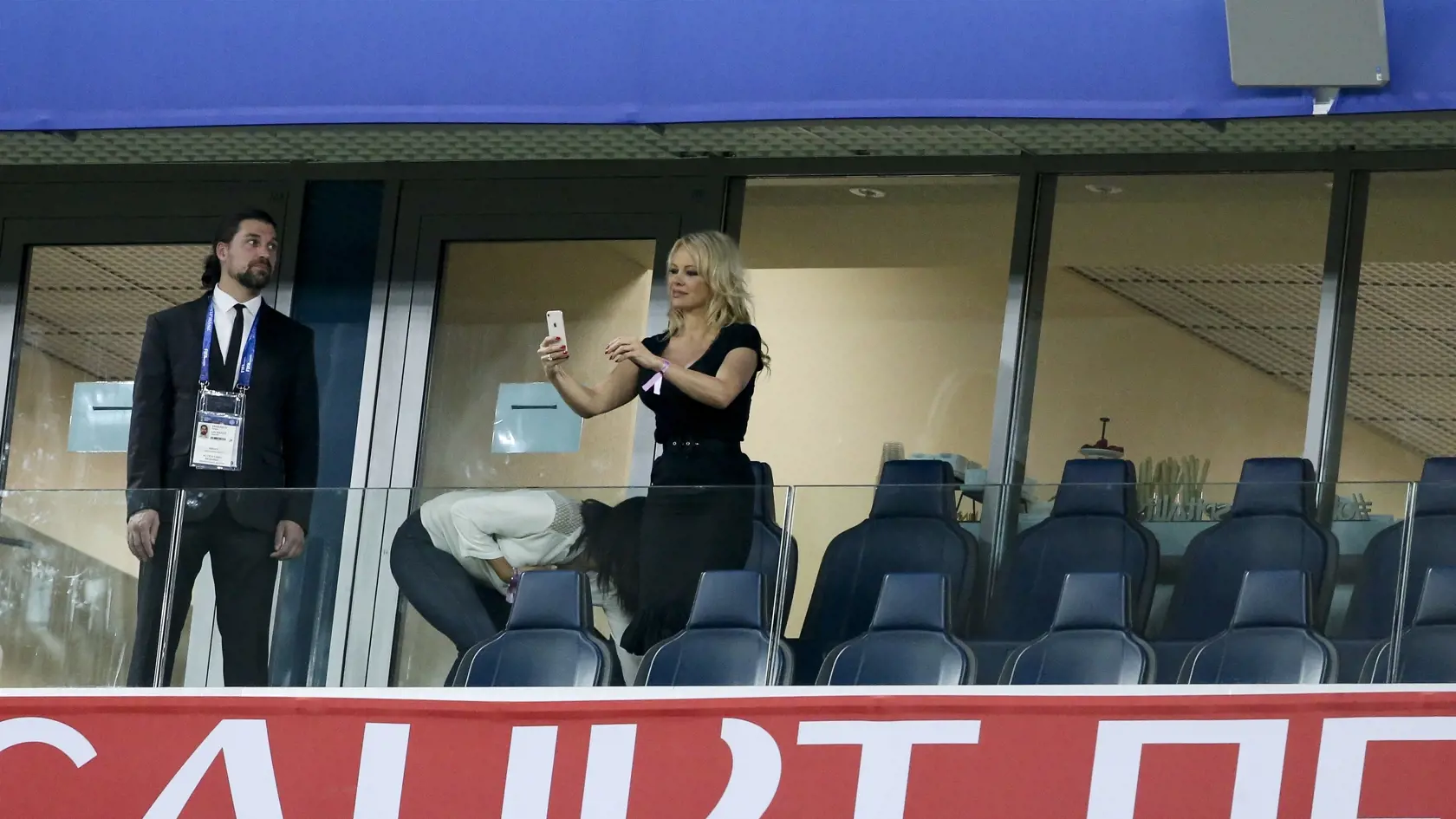 SAINT PETERSBURG, RUSSIA - JULY 10: Pamela Anderson, girlfriend of Adil Rami of France celebrates the victory following the 2018 FIFA World Cup Russia Semi Final match between France and Belgium at Saint Petersburg Stadium on July 10, 2018 in Saint Petersburg, Russia. (Photo by Jean Catuffe/Getty Images)