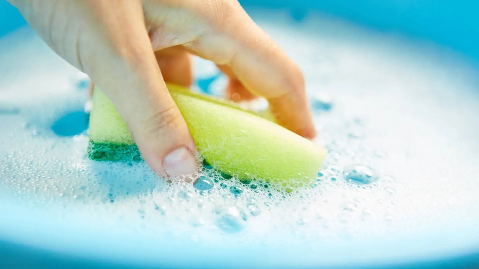 Hand,Dips,Sponge,In,Bucket,Of,Soapy,Water,During,House