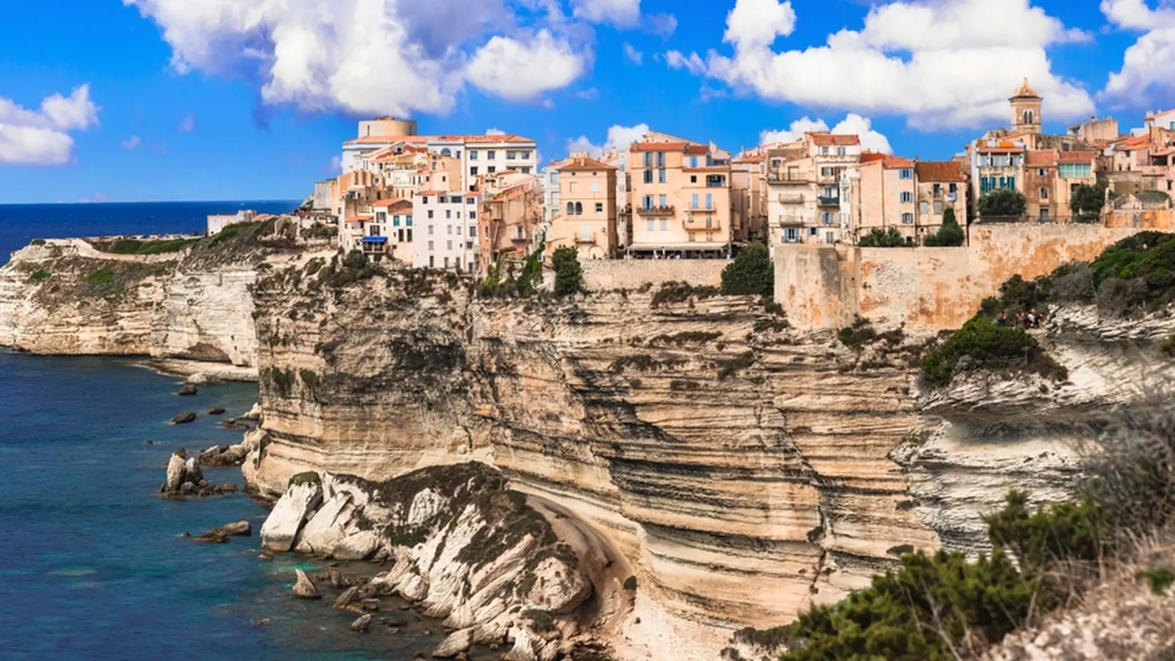 Corsica island, Bonifacio - beautiful coastal town in south.  Panoramic  view of houses hanging over rocks. France
