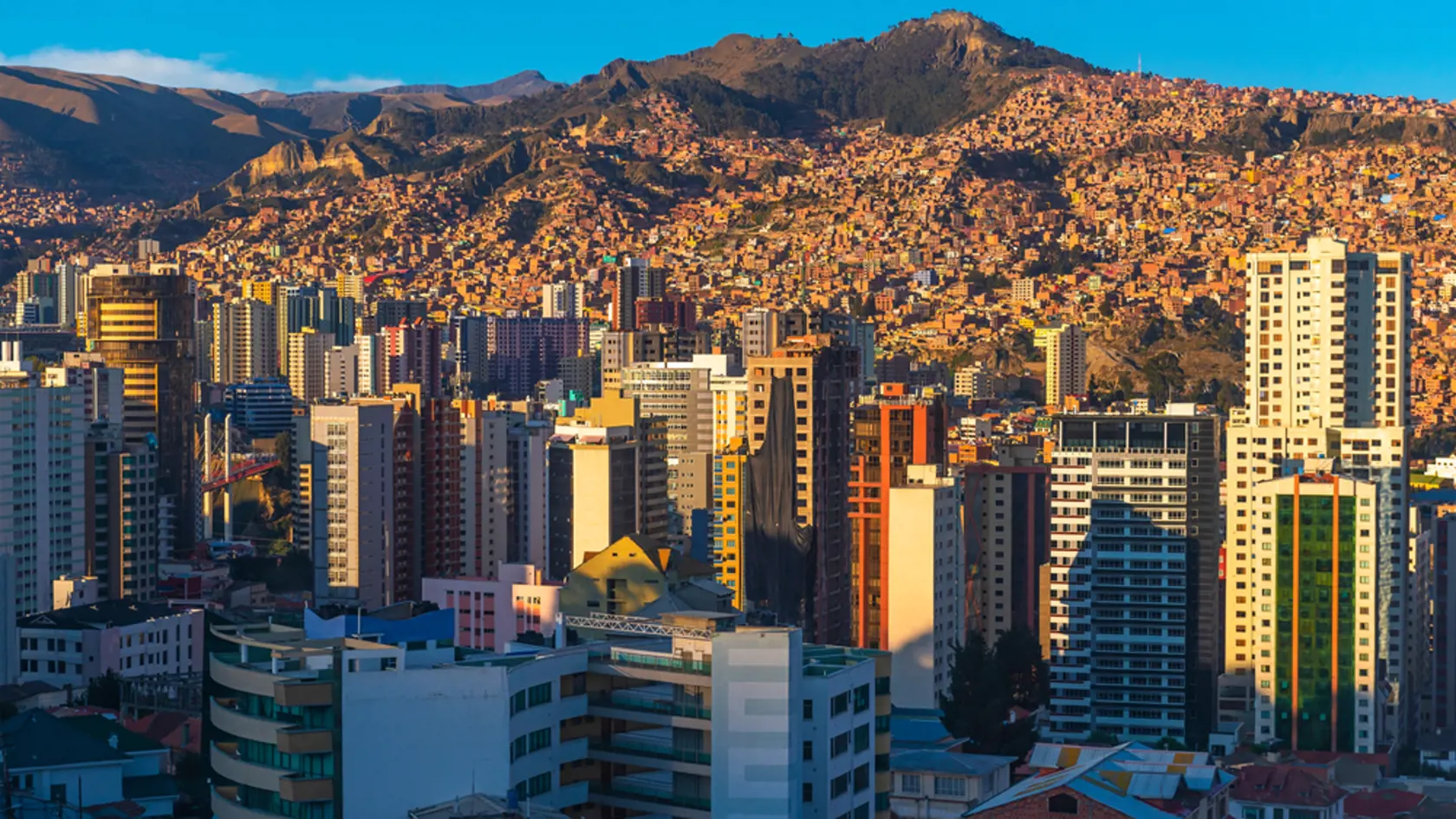 Cityscape of La Paz with its modern urban skyline and skyscrapers at sunset, Andes Mountains, Bolivia.