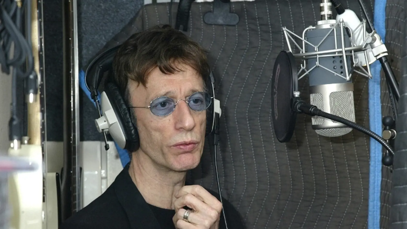 Robin Gibb si myslí, že jeho nedávny boj s rakovinou je určitou odplatou za jeho úspech.