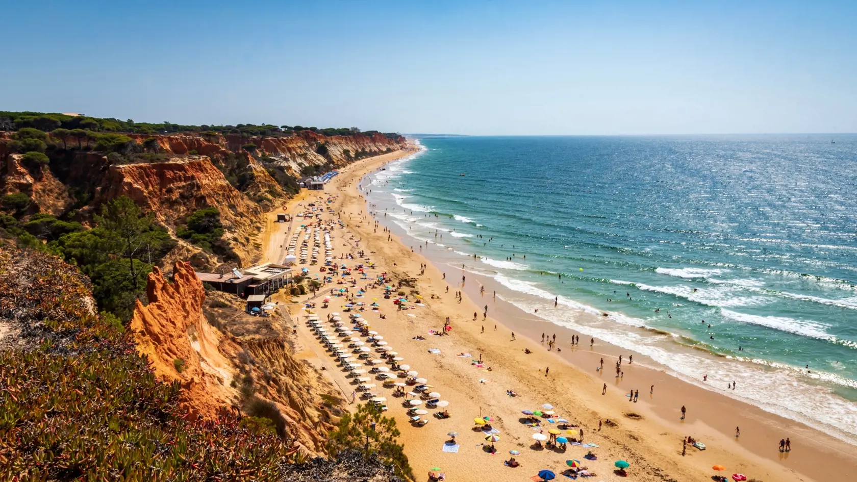 Colorful orange cliffs at Praia da Falesia, Portugal.