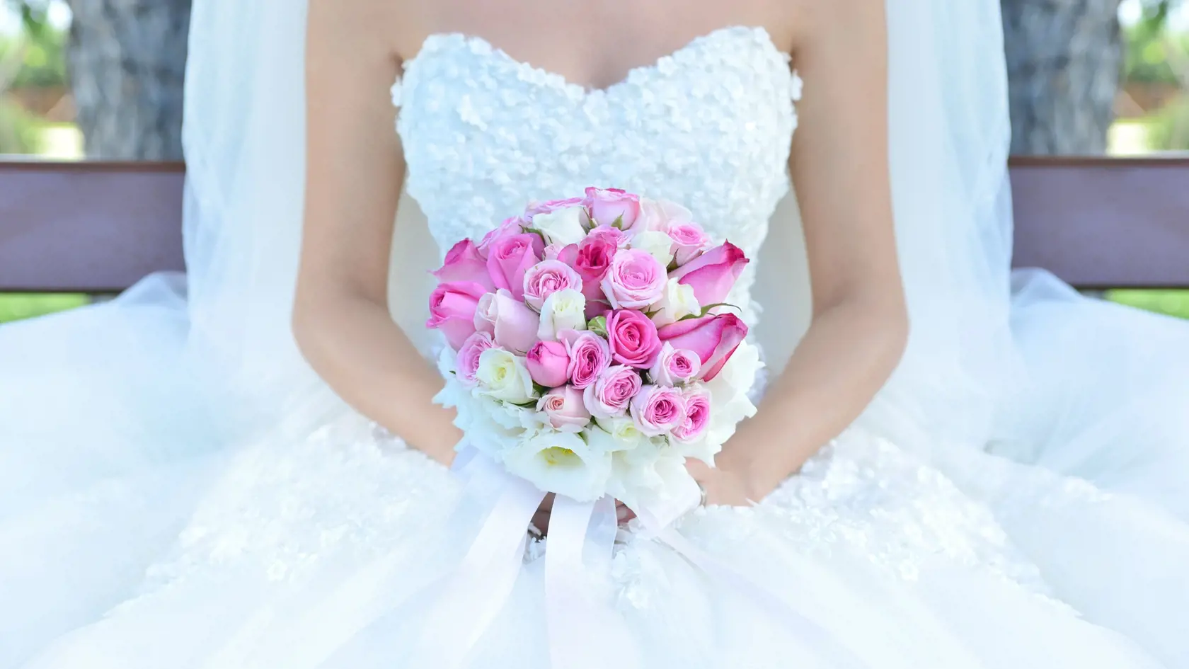 Bride holding flower bouquet. Stock Image