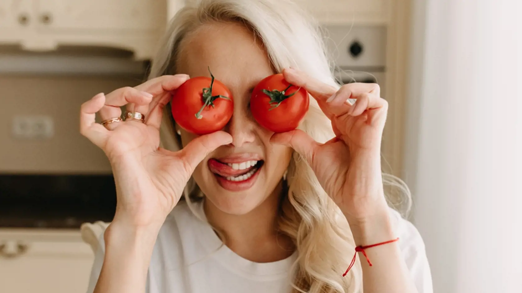 Blonde,Woman,Holding,Two,Tomatoes,,Covering,Eyes.,Tomato,Eyes.