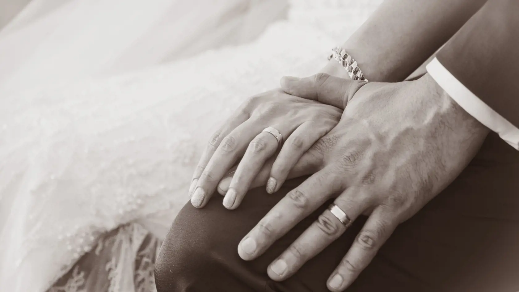 Newly wed couple's hands with wedding rings (Sepia tones)
