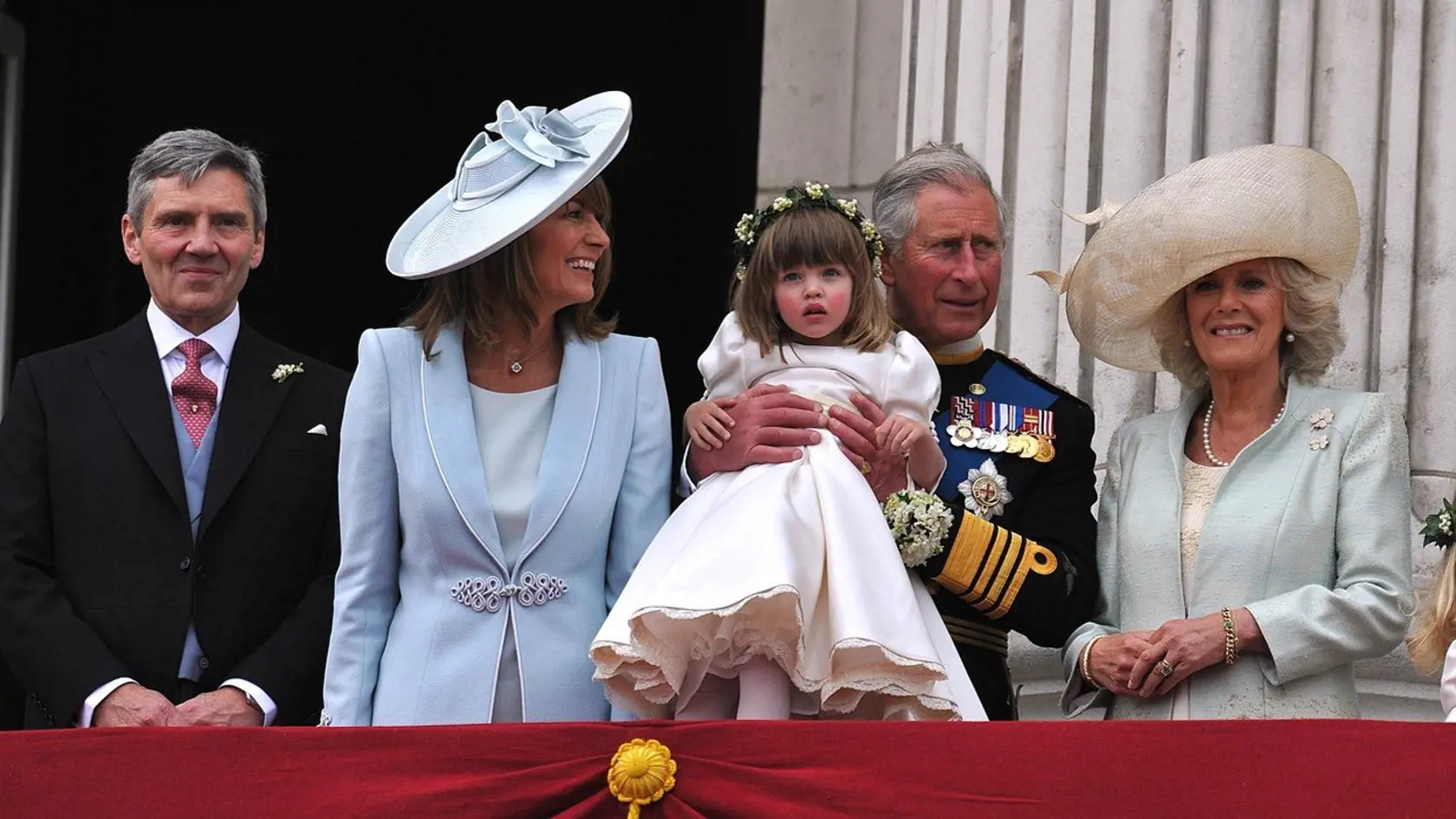 (From L) Michael Middleton, Carole Middleton, Britain's Prince Charles, holding bridesmaid Eliza Lopes and Camilla, the Duchess of Cornwall, appear on the balcony of Buckingham Palace in London on April 29, 2011, following the wedding of Britain's Prince William and Kate, Duchess of Cambridge., Image: 93289642, License: Rights-managed, Restrictions: -, Model Release: no, Credit line: Profimedia, AFP
