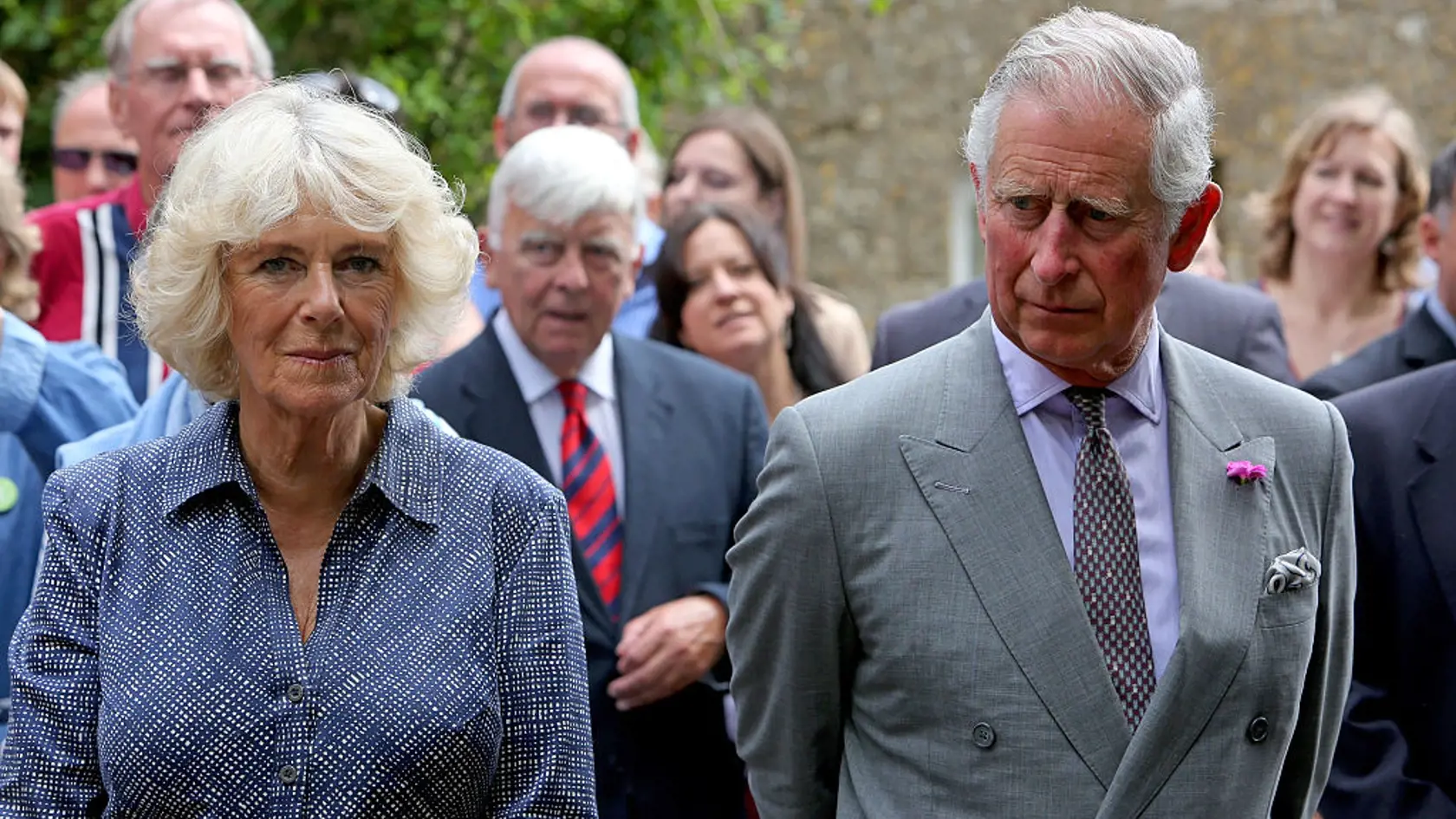 BRIMPSFIELD, ENGLAND - JUNE 12: Prince Charles, Prince of Wales (R) and Camilla, Duchess of Cornwall (L) attend a street party as part of the three day celebrations for Queen Elizabeth II's official 90th birthday on June 12, 2016 in Brimpsfield, Gloucestershire, England. The Big Lunch is an annual event started by the Eden Project which aims to get as many people as possible to have lunch together, in their neighbourhoods, in order to encourage more of a community spirit throughout the Nation. (