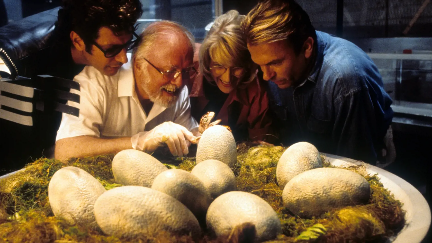 Jeff Goldblum, Richard Attenborough, Laura Dern and Sam Neill watch dinosaur eggs hatch in a scene from the film 'Jurassic Park', 1993. (Photo by Universal/Getty Images)