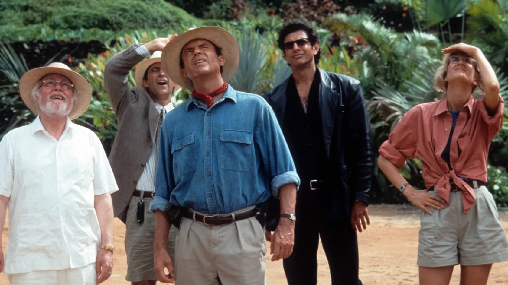 From left to right, Richard Attenborough, Martin Ferrero, Sam Neill, Jeff Goldblum and Laura Dern look up in a scene from the film 'Jurassic Park', 1993. (Photo by Universal/Getty Images)