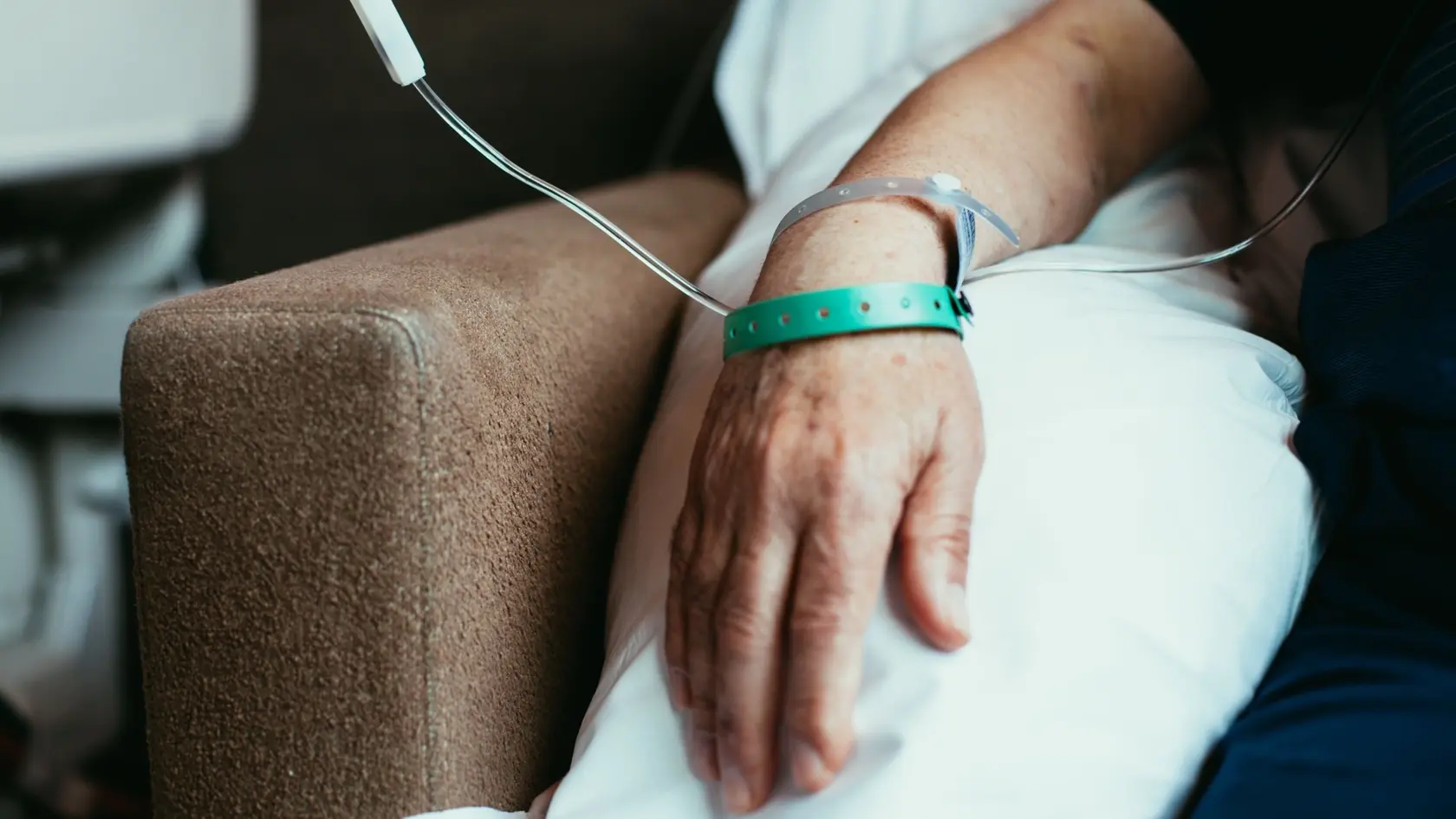 Old man patient hand in hospital