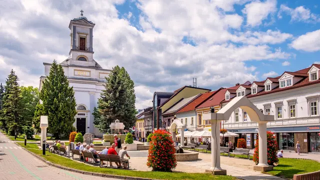 Poprad, Presov region / Slovakia - 2019/06/28: Holy Trinity Evangelic church - Evanjelicky kostol svatej Trojice - at the St. Egidius square in Poprad historic quarter