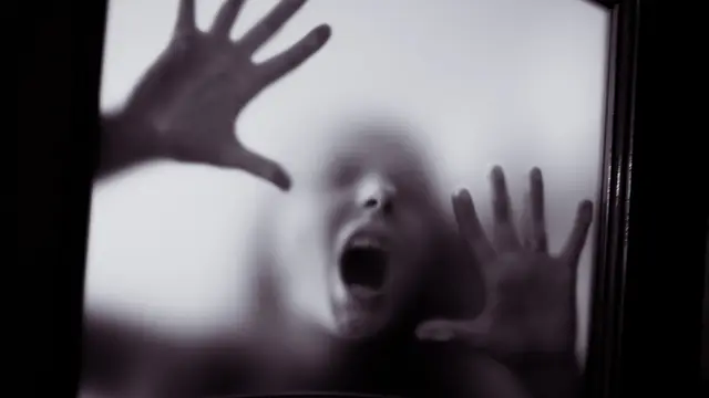 scary picture of hands behind glass, horror ghost woman behind door, Halloween  concept