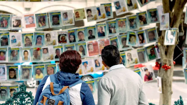 Puebla, Mexico - 07122023: people see photos of missing people in Mexico